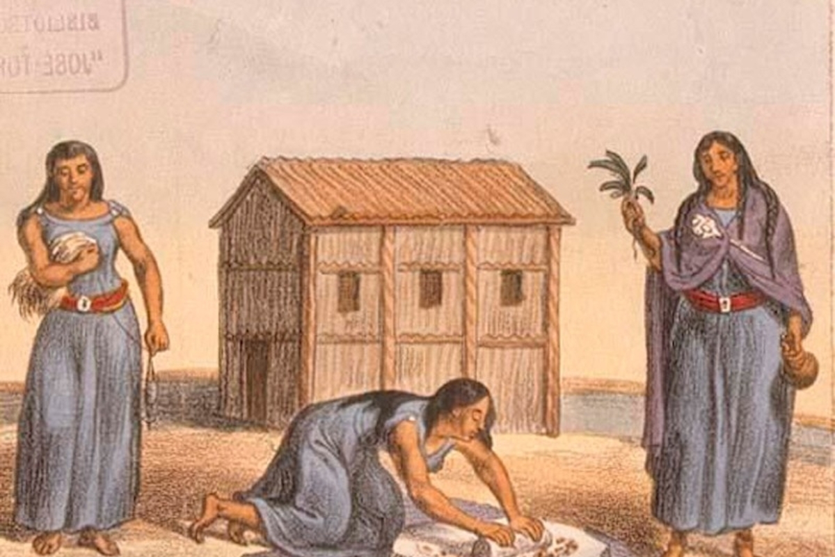 Mujeres mapuches moliendo grano