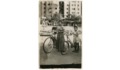 4. Joven y niña en bicicleta en la Plaza Baquedano. Santiago, entre 1930 y 1950.