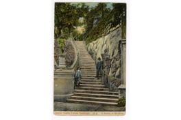 5. Un niño y un adulto en una escalera del cerro Santa Lucía, conocida como "Subida de las niñas". Alrededor del año 1900.